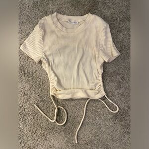 Rumored open back crop top with ties. Light cream color. Size S